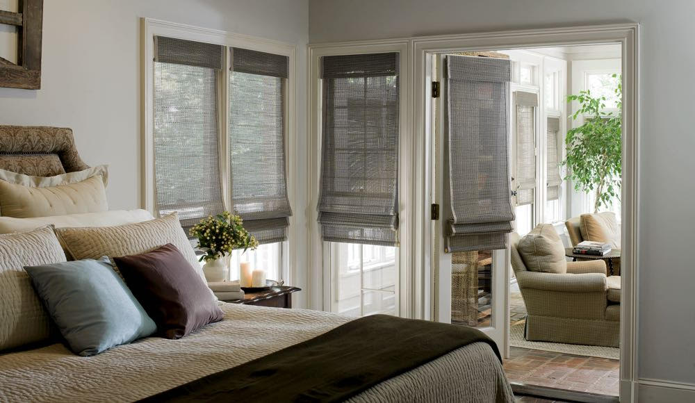 grey woven shades in bedroom windows